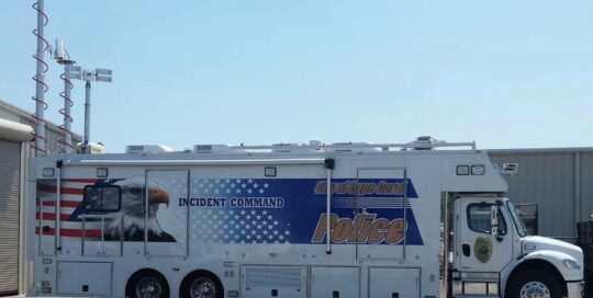 Police incident command vehicle with eagle graphic.
