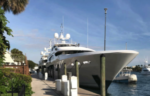 Luxury yacht docked at a marina.